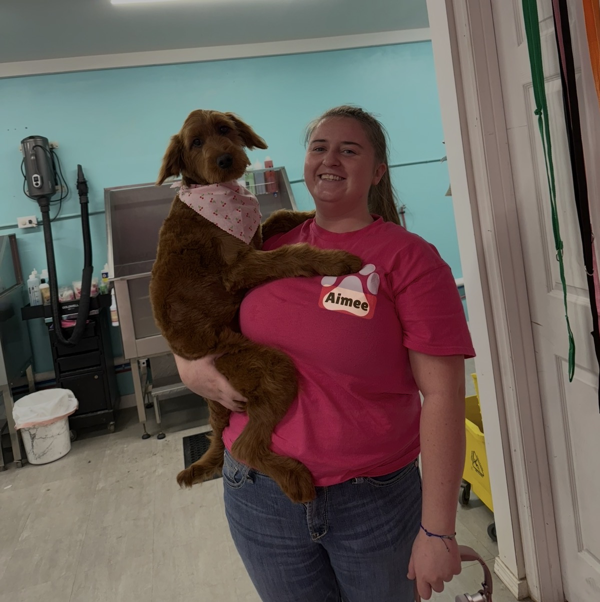 Aimee holding a fluffy dog